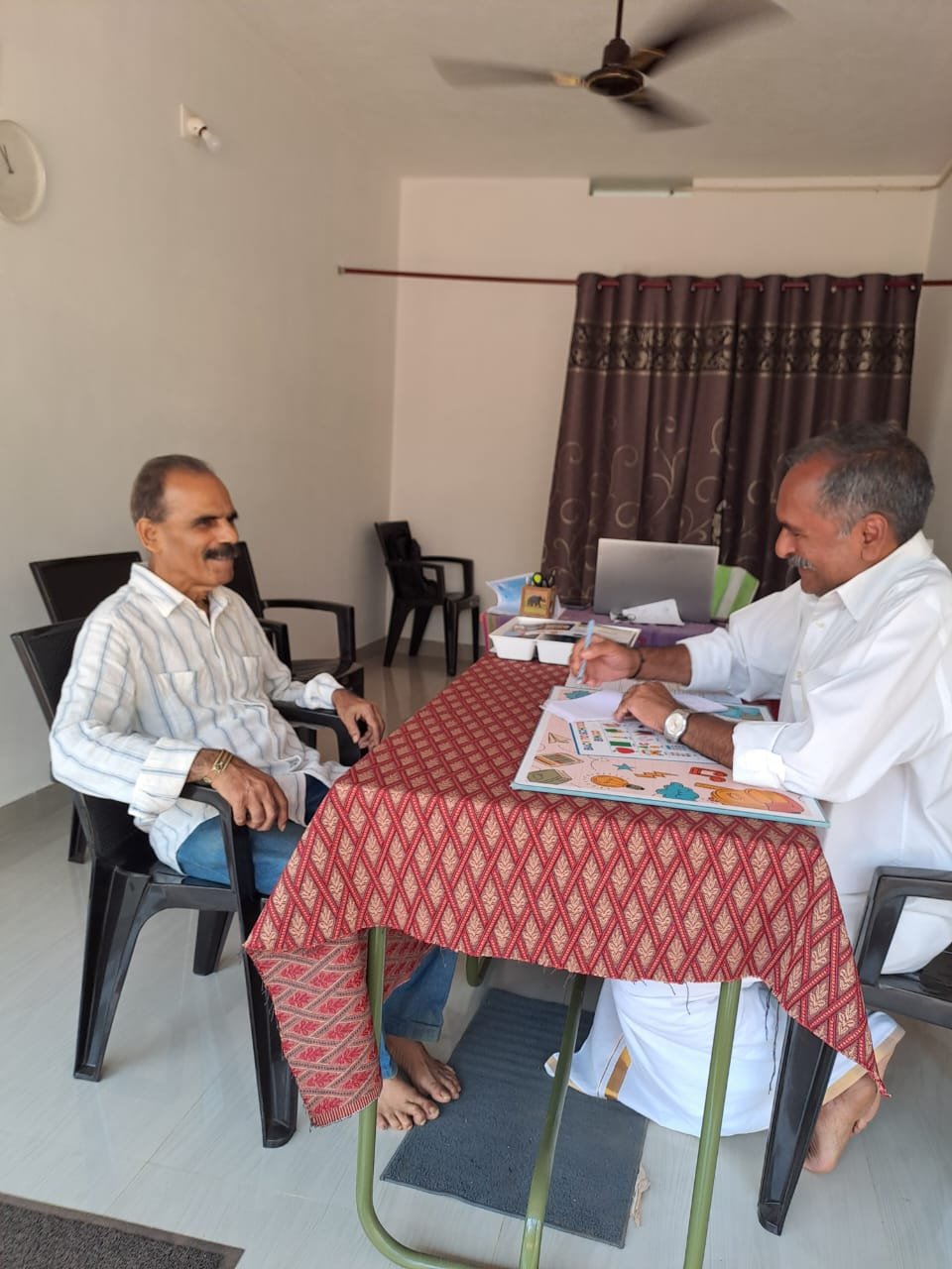 Photo Of Doctor While Performing Consultancy