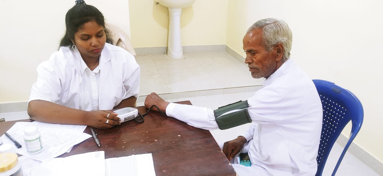 Photo Of Doctor While Performing Consultancy