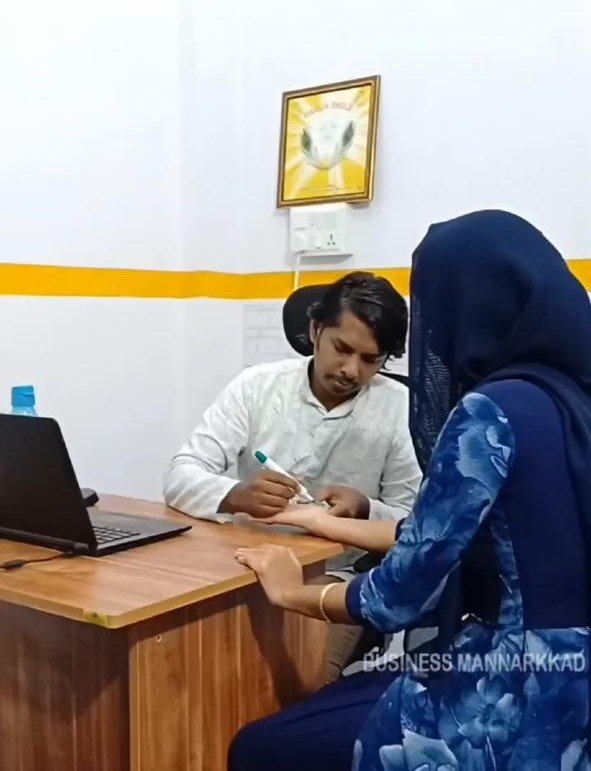 Photo Of Doctor While Performing Consultancy